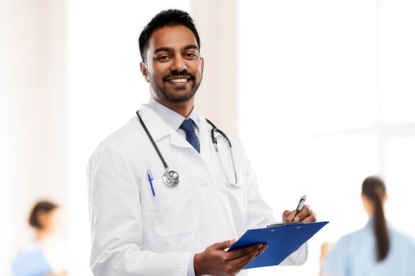 Doctor wearing white appron received his professional loan